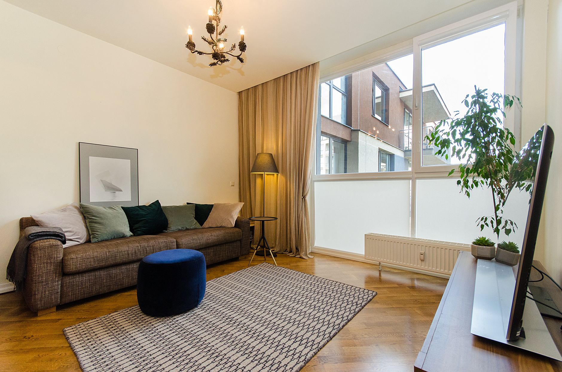 A warm and inviting modern living room with natural light and stylish decor.